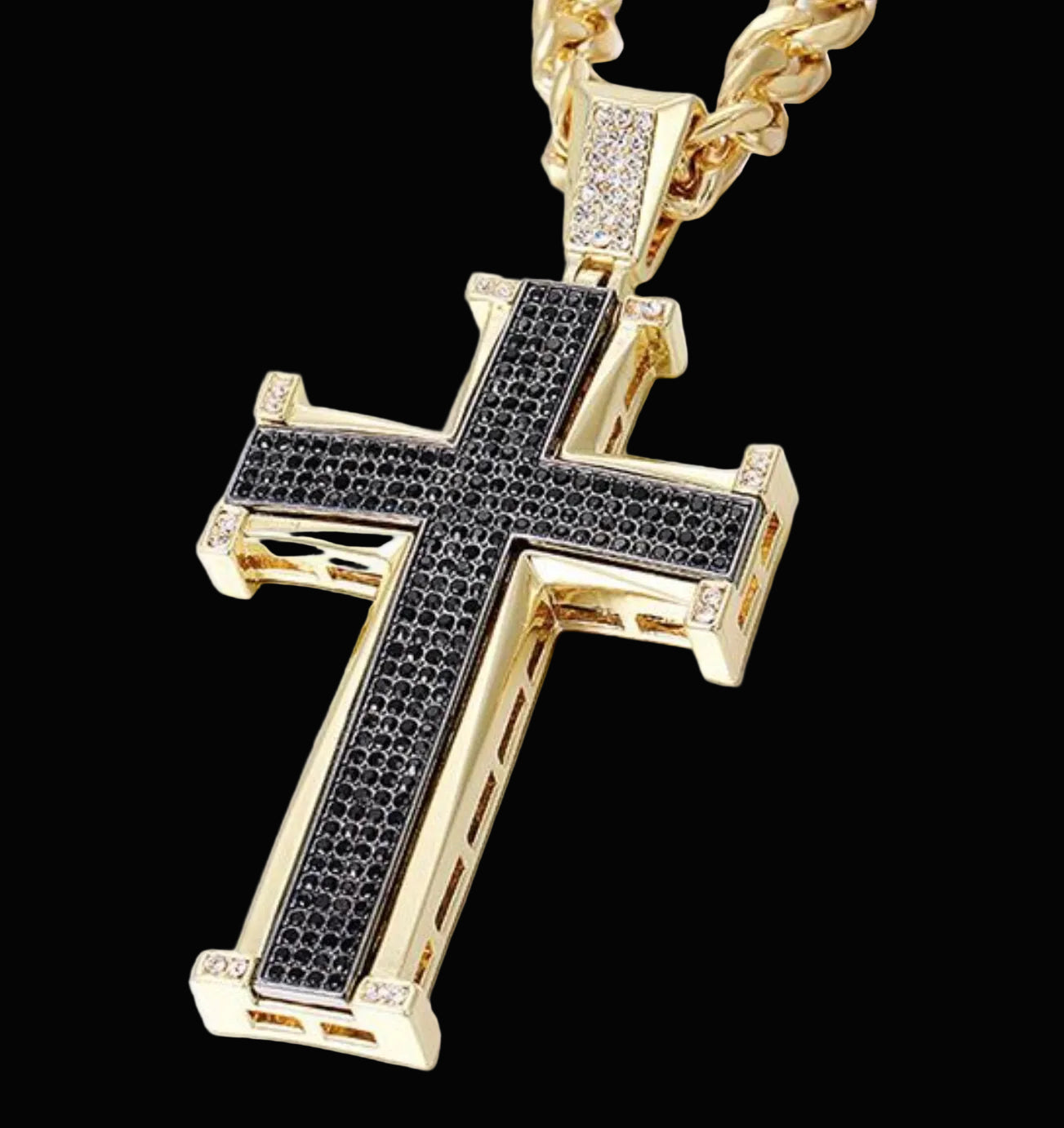 Gold cross pendant with black stones on a white background