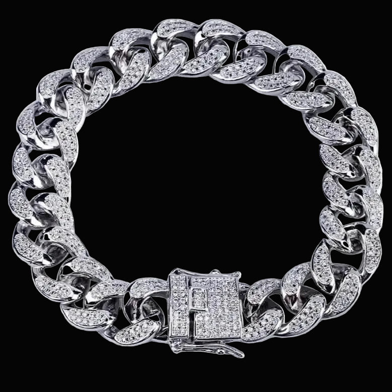 Silver chain bracelet with diamond-like stones on a white background
