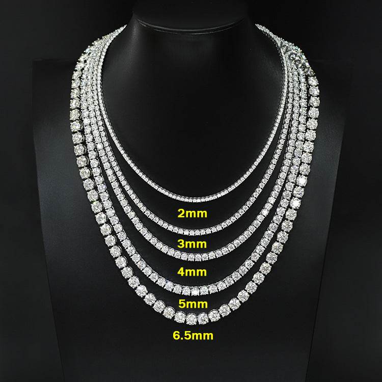 Stack of diamond necklaces with size measurements on a black background