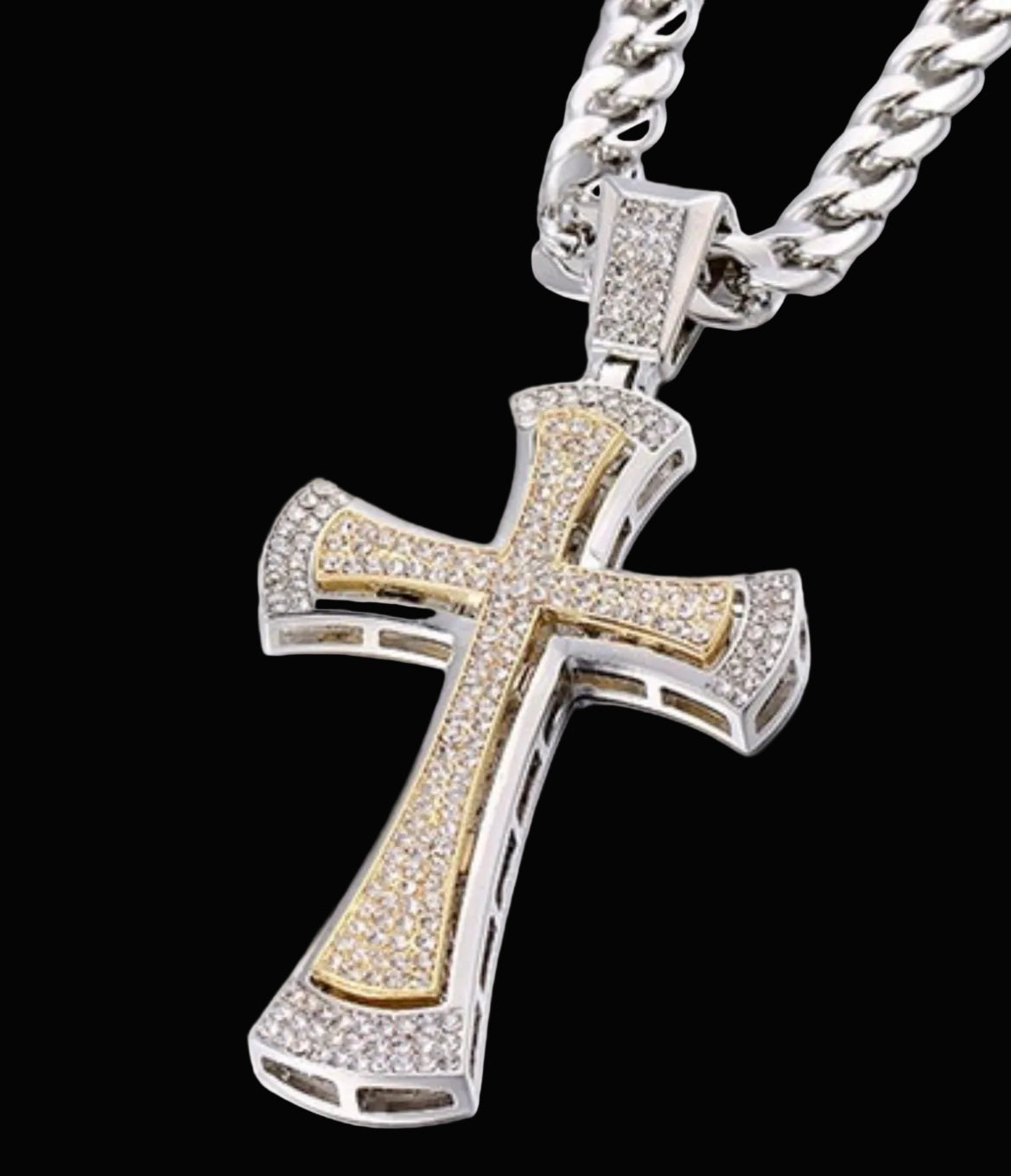 Two-tone cross pendant with chain on a white background